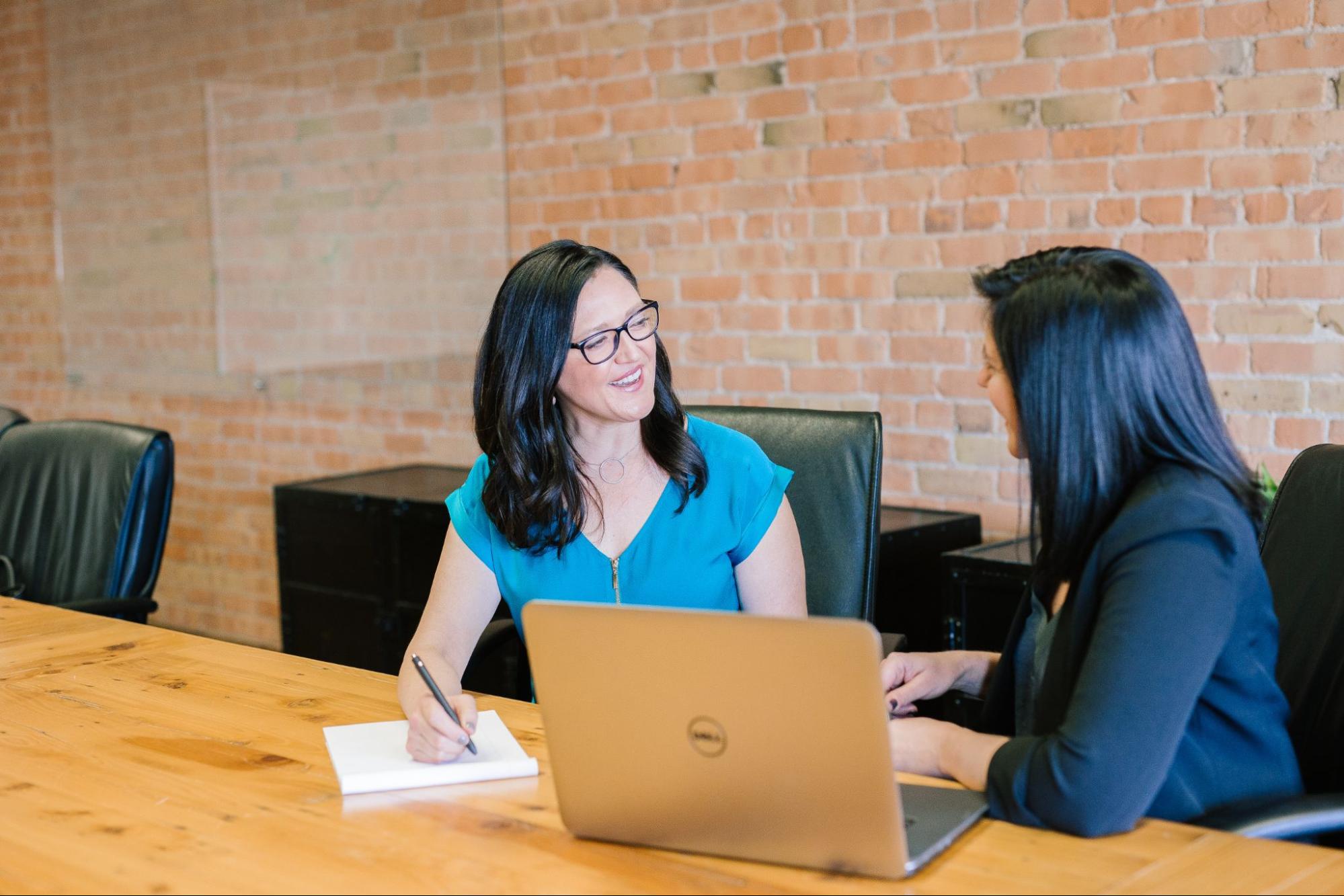 Two women sitting at a table.